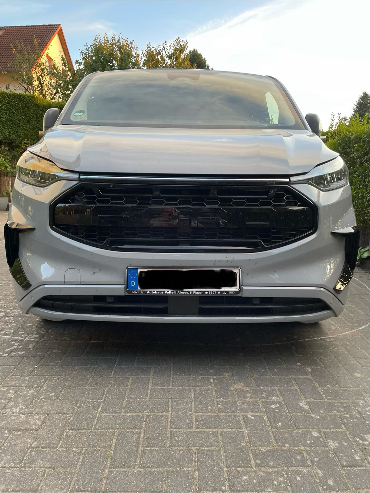 Transit Custom MK3 front canards installed — glossy black 2024+